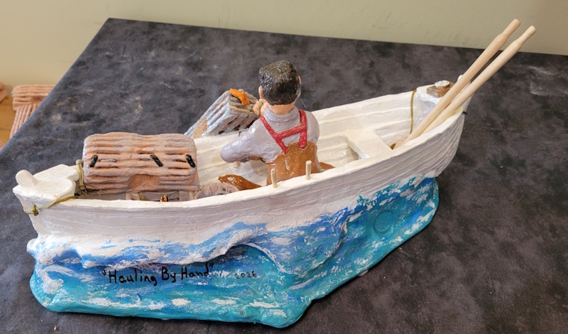 a fisherman hauling traps by hand