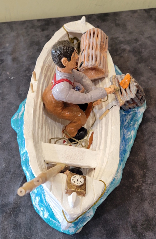 a fisherman hauling traps by hand