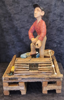 a Cape Island fisherman on a wharf with small Cape Island boats