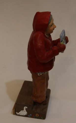 A portrait figurine of our fmous folk artist, Maud Lewis.