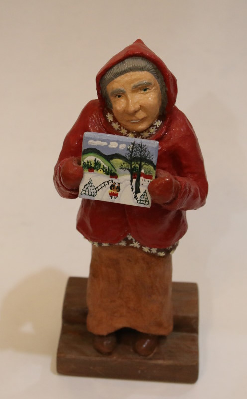 A portrait figurine of our fmous folk artist, Maud Lewis.